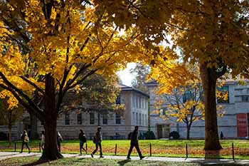 Students walking on the campus quad in autumn